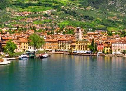 An image of a small town on the water, Lake Garda Luxury Sailing Adventure.