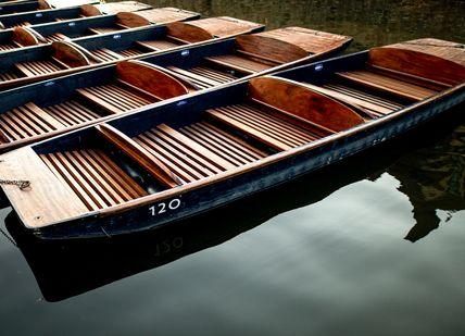 An image of a row of boats in the water, One night in a 4-star hotel in central Cambridge. Getaway-Pseudo-Supplier