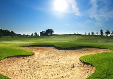 An image of a golf course with a hole, Royal Lytham & St Anne's Lancashire Golf Break. Getaway-Pseudo-Supplier