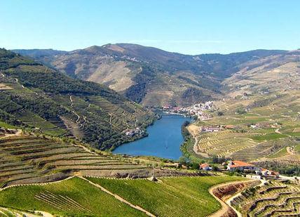 An image of a valley with a lake in the middle, Stay in Porto.