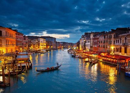 An image of a canal at night, Three Nights in a Five-Star Hotel in Venice.