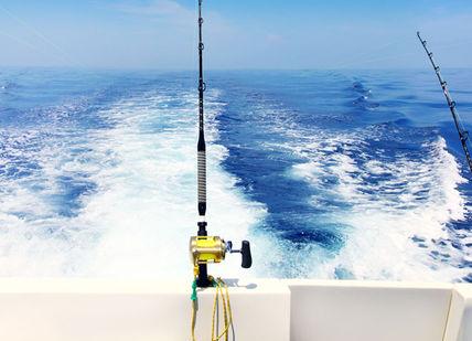 An image of a boat with two rods, Two-day big game private fishing charter tour in Madeira.