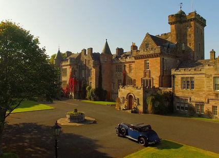 An image of a castle with a car parked in front, Stargazing and Two-Night Stay. Glenapp Castle