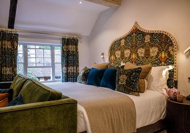 An image of a bedroom with a bed and a couch, An Overnight Stay At Great Fosters And Tasting Menu. Great Fosters