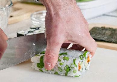 An image of someone cutting a su, Learn To Make Sushi. Greenwich Pantry