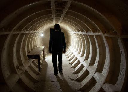 An image of a person in a tunnel, Secret Underground Public Tour. Hidden London