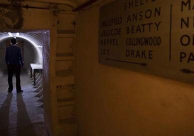 An image of a man walking through a tunnel, Secret Underground Tour of Clapham South Station. Hidden London