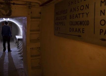 An image of a man walking through a tunnel, Secret Underground Tour of Clapham South Station. Hidden London