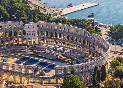 An image of a city with a large circular building, Luxury Seven-Day Istria Getaway. Honeymoon Croatia