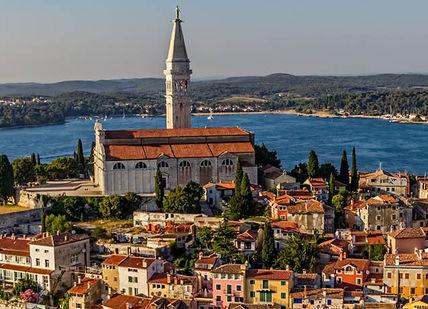 An image of a city with a church on the top, Luxury Seven-Day Istria Getaway. Honeymoon Croatia