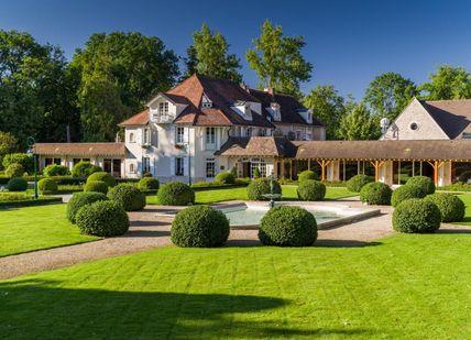 An image of a house with a garden, 2-night stay in Deluxe Room. Hostellerie De Levernois