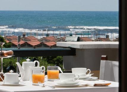 An image of a table with a view of the ocean, Family Escape To Forte dei Marmi Italy. Hotel Byron