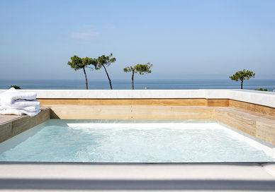 An image of a hot tub on a deck, Italian Cullinary Retreat To Forte Dei Marmi. Hotel Byron