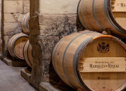 An image of a wine cellar with barrels, Spain Wine Break Dinner. Hotel Marques de Riscal