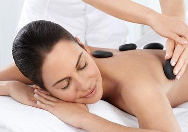 An image of a person having hot stone massage