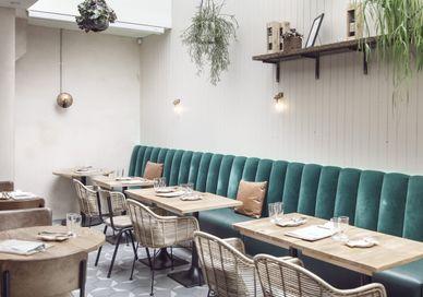 An image of a restaurant setting with tables and chairs, Islington, London. Humble Grape