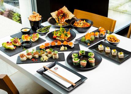 An image of a table with a variety of food, Magic Masterclass with Dinner and Drinks. inamo Restaurants