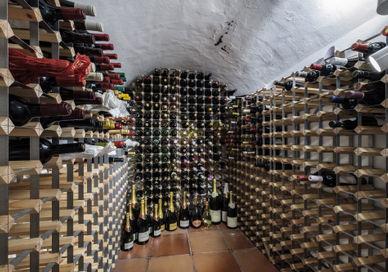 An image of a wine cellar with many bottles, Walton Street, London. Jeroboams