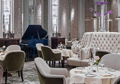 An image of a restaurant with many tables and chairs, The Langham, Palm Court. The Langham, Palm Court