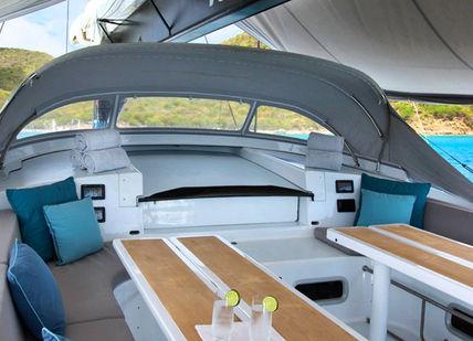 An image of a boat with a table and chairs, Catered Day Charter of Leopard 3 Super Maxi Yacht. Leopard3