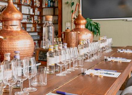 An image of a bar with a bunch of wine glasses, Premium Spiced Rum Creation Class. Liquor Studio
