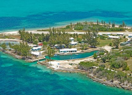 An image of a small island with a house on it, Private Island Group Holiday on Little Whale Cay. Little Whale Cay