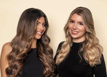 An image of two women with long hair, Shampoo, Head Massage + Ladies Cut and Blow Dry + Ultimate treatment + Glass of Champagne + FUL Intense Moisturising Hair Mask (Take Home) . Live True London