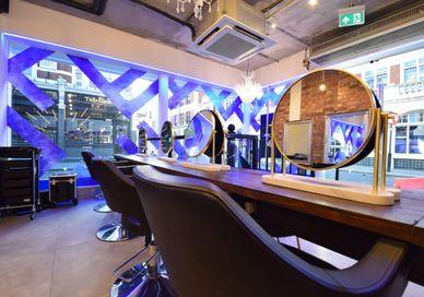 An image of a salon with a mirror, Shampoo, Head Massage + Ladies Cut and Blow Dry + Ultimate treatment + Glass of Champagne + FUL Intense Moisturising Hair Mask (Take Home) . Live True London