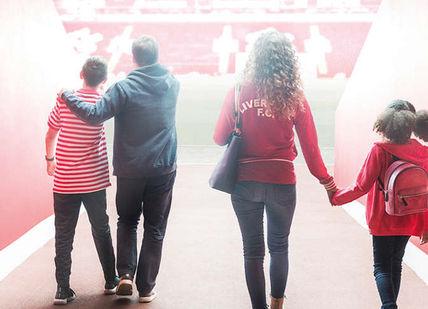 An image of a family walking down a hallway, Private Anfield Stadium Tour with a Club Legend and Lunch. Liverpool Football Club