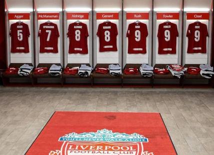 An image of a dressing room with red and white jerseys, Liverpool Football Club. Liverpool Football Club