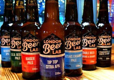 An image of six bottles of beer on a table, Beer Making Workshop. London Beer Lab