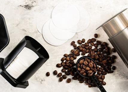 An image of coffee beans and a coffee grinder, Home Enthusiast Coffee Course. London School Of Coffee