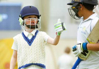 An image of a little boy playing cricket, Private Children's Lesson. Lord's Indoor Cricket Centre