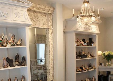 An image of a room with a mirror and a shelf, Lucy Choi London Boutique. Lucy Choi London Boutique