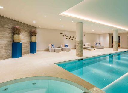 An image of a pool with a hot tub, Relax and Brunch London. Luenire