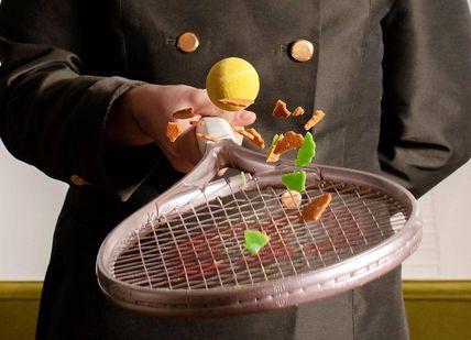 An image of a tennis player holding a tennis racket, Teamaster's Afternoon Tea. Mandarin Oriental - The Rosebery