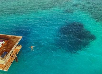 An image of a floating house in the ocean, Sleep Under The Sea in Tanzania. The Manta Resort