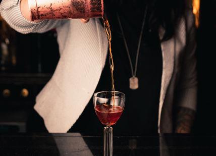 An image of a bartender pouring a drink, Cocktail Making Masterclass with Tapas Style Afternoon Tea. Map Maison