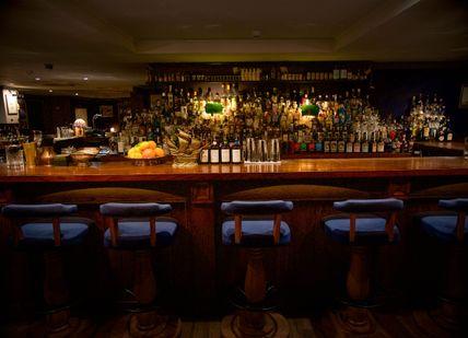 An image of a bar with a bunch of bottles, Premium Irish Whiskey Tasting. Merchant House