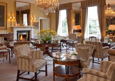 An image of a living room with a fireplace, Art Inspired Getaway. The Merrion Hotel
