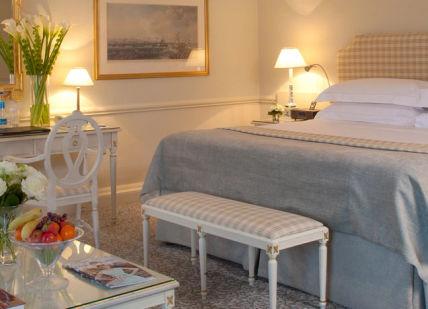 An image of a bedroom with a bed and chairs, Art Inspired Getaway. The Merrion Hotel