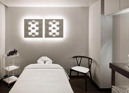An image of a massage room with a white bed, Metropolitan by COMO. Metropolitan by COMO