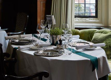 An image of a table setting in a restaurant, Tasting menu at Cheneston’s Restaurant . The Milestone Hotel