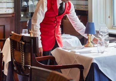 An image of a man in a restaurant setting, Set Menu Dining at Blue Door Bistro. Montague on the Gardens