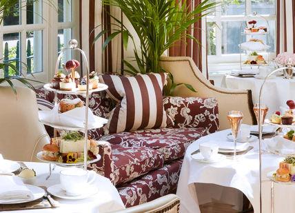 An image of a restaurant setting, The Ultimate Bottomless Afternoon Tea. Montague on the Gardens