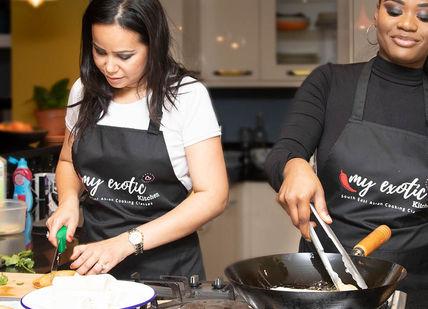 An image of two women cooking together, Asian Vegan Cooking Class. My Exotic Kitchen