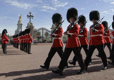 An image of a group of soldiers marching, Private Highlights Royal Tour and The Changing of The Guard. In The Name of The Crown