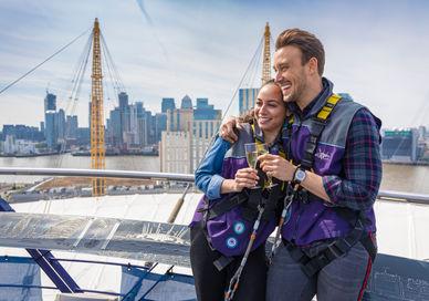 An image of a man and woman on a boat, Submit The O2 wiith a Champagne on the roof. THE O2