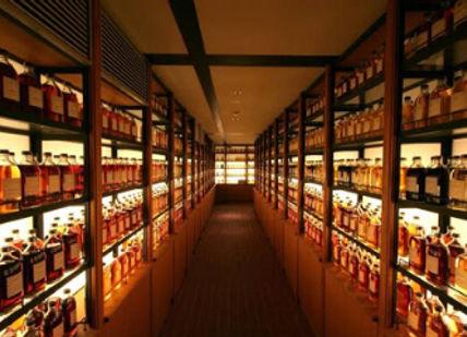 An image of a store with shelves full of liquor, Private Premium Whisky Tour of Tokyo. Oishii Tours