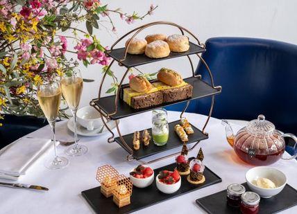 An image of a table with food and drinks, Champagne Afternoon Tea in one of London’s most iconic buildings. OXO Tower Restaurant